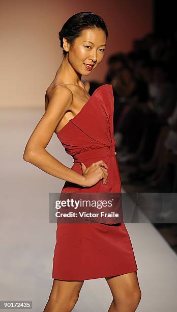 Model showcases designs by Thakoon on the catwalk as part of the Red Dress Collection showcase during the Mastercard Luxury Week Hong Kong 2009 at...