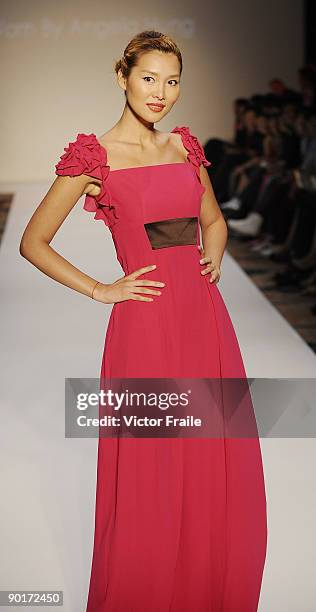 Model showcases designs by Escada on the catwalk as part of the Red Dress Collection showcase during the Mastercard Luxury Week Hong Kong 2009 at The...