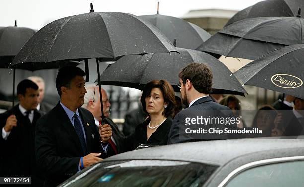 Light and steady rain pours down as family members, including widow Victoria Kennedy , arrive for the funeral service of Sen. Edward Kennedy at Our...
