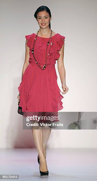 Model showcases designs by Escada on the catwalk as part of the Red Dress Collection showcase during the Mastercard Luxury Week Hong Kong 2009 at The...
