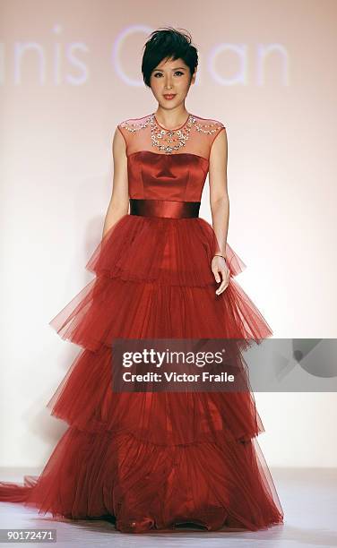 Model showcases designs by Dorian Ho on the catwalk as part of the Red Dress Collection showcase during the Mastercard Luxury Week Hong Kong 2009 at...