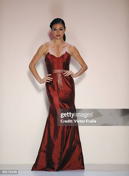 Model showcases designs by Dorian Ho on the catwalk as part of the Red Dress Collection showcase during the Mastercard Luxury Week Hong Kong 2009 at...