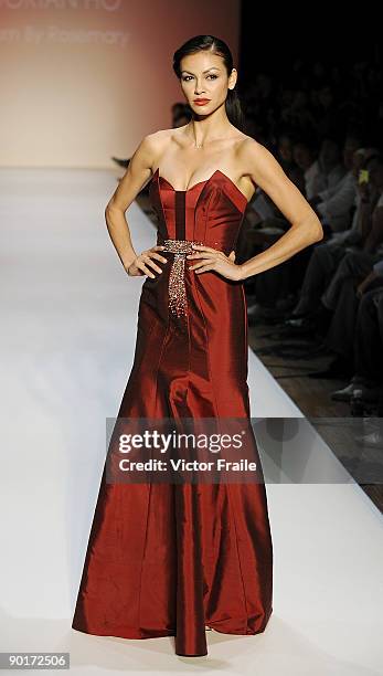 Model showcases designs by Dorian Ho on the catwalk as part of the Red Dress Collection showcase during the Mastercard Luxury Week Hong Kong 2009 at...