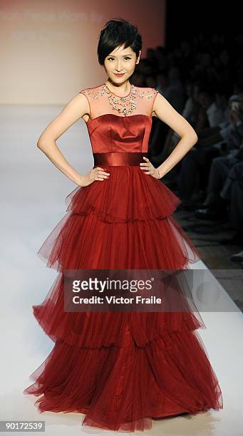 Model showcases designs by Dorian Ho on the catwalk as part of the Red Dress Collection showcase during the Mastercard Luxury Week Hong Kong 2009 at...