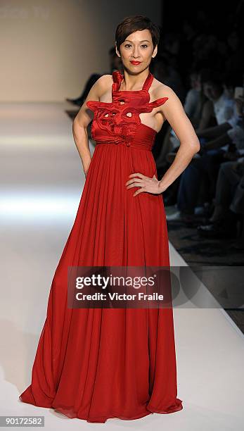 Model showcases designs by Vivienne Tam on the catwalk as part of the Red Dress Collection showcase during the Mastercard Luxury Week Hong Kong 2009...