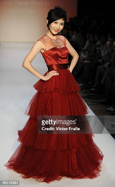 Model showcases designs by Dorian Ho on the catwalk as part of the Red Dress Collection showcase during the Mastercard Luxury Week Hong Kong 2009 at...