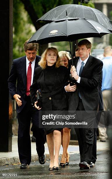 Light and steady rain pours down as Rep. Patrick Kennedy escorts his mother Joan Bennett Kennedy to the funeral for Sen. Edward Kennedy at Our Lady...