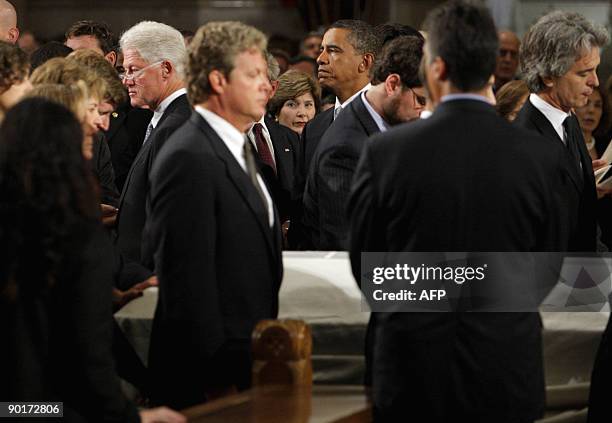Pallbearers from the Kennedy family including Senator Edward Kennedy's son Edward Kennedy Jr, his stepson Curran Raclin and his nephew Bobby Shriver...
