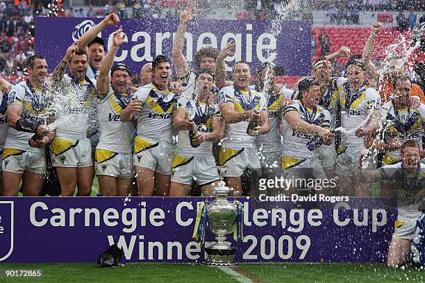 Warrington celebrate following their victory during the Carnegie Challenge Cup Final between Huddersfield Giants and Warrington Wolves at Wembley...