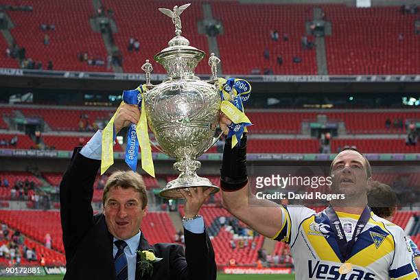 Tony Smith the coach of Warrington and Adrian Morley of Warrington celebrate with the trophy following their teams victory during the Carnegie...