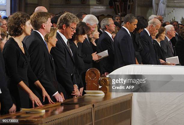 The white draped casket of US Senator Edward Kennedy sits in front of the Senator's stepdaughter Caroline Raclin, his son Congressman Patrick...
