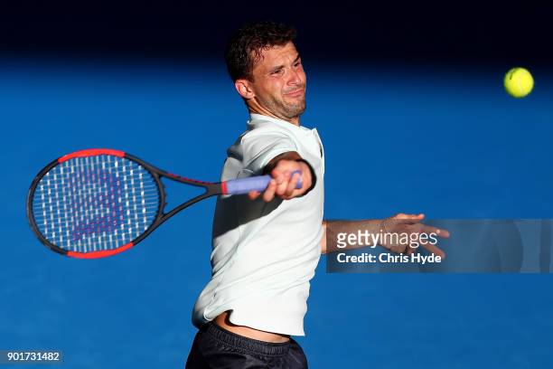 Grigor Dimitrov of Bulgaria plays a forehand in his semi final match against Nick Kyrgios of Australia during day seven of the 2018 Brisbane...