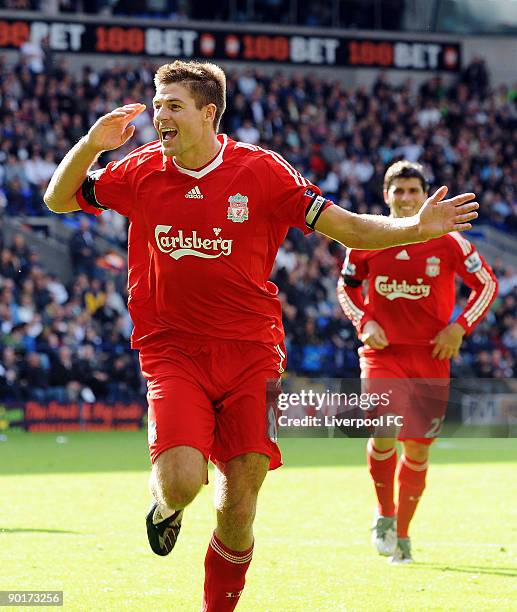 Captain of Liverpool Steven Gerrard celebrates scoring the third goal for Liverpool during the Barclays Premier League match between Bolton Wanderers...