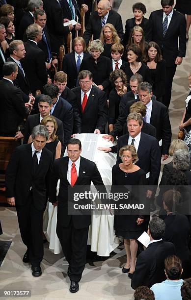 Family members carry the casket of late US Senator Edward Kennedy out of the Our Lady of Perpetual Help Basilica at the end of his funeral mass in...