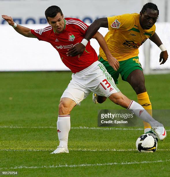 Fereira Wagner of FC Lokomotiv Moscow battles for the ball with Emmanuel Okoduva of FC Kuban Krasnodar during the Russian Football League...