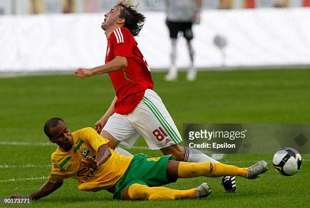 Alan Gatagov of FC Lokomotiv Moscow battles for the ball with William Boaventura of FC Kuban Krasnodar during the Russian Football League...