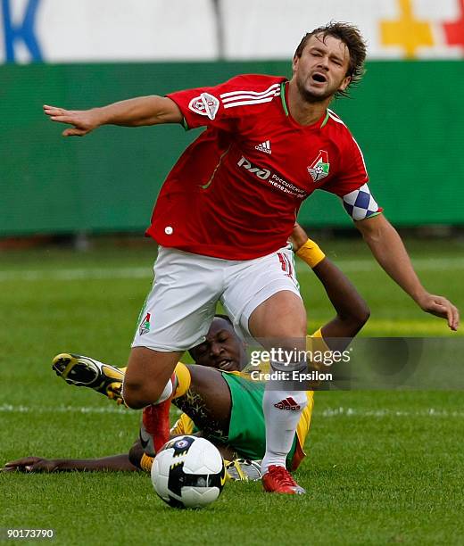 Dmitry Sychev of FC Lokomotiv Moscow battles for the ball with Haminu Draman of FC Kuban Krasnodar during the Russian Football League Championship...