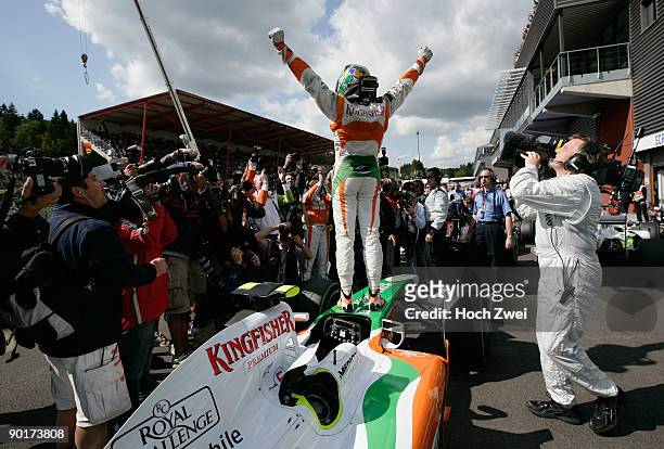 Giancarlo Fisichella of Italy and Force India celebrates in parc ferme after taking pole position during qualifying for the Belgian Grand Prix at the...