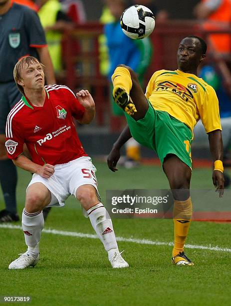 Renat Yanbaev of FC Lokomotiv Moscow battles for the ball with Haminu Draman of FC Kuban Krasnodar during the Russian Football League Championship...