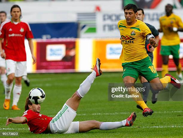 Dmitry Sychev of FC Lokomotiv Moscow battles for the ball with Andrey Topchu of FC Kuban Krasnodar during the Russian Football League Championship...