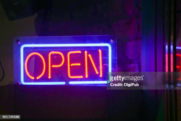 "open" neon sign - neon open sign stock pictures, royalty-free photos & images