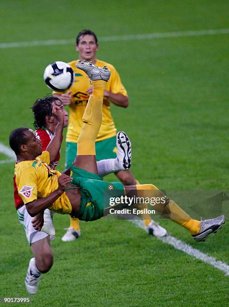 Alan Gatagov of FC Lokomotiv Moscow battles for the ball with Haminu Draman of FC Kuban Krasnodar during the Russian Football League Championship...