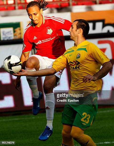 Peter Odemwingie of FC Lokomotiv Moscow battles for the ball with Georgy Dzhioev of FC Kuban Krasnodar during the Russian Football League...