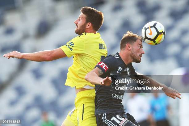 James Troisi of the Victory competes in the air during the round 14 A-League match between the Melbourne Victory and the Central Coast Mariners at...