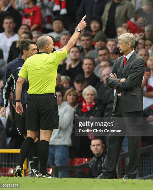 Arsene Wenger of Arsenal is sent to the stand during the FA Barclays Premier League match between Manchester United and Arsenal at Old Trafford on...