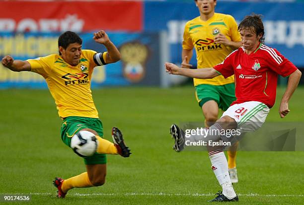 Alan Gatagov of FC Lokomotiv Moscow battles for the ball with Andrey Topchu of FC Kuban Krasnodar during the Russian Football League Championship...