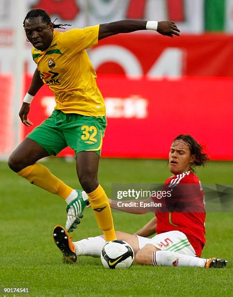 Tomislav Dujmovic of FC Lokomotiv Moscow battles for the ball with Emmanuel Okoduva of FC Kuban Krasnodar during the Russian Football League...