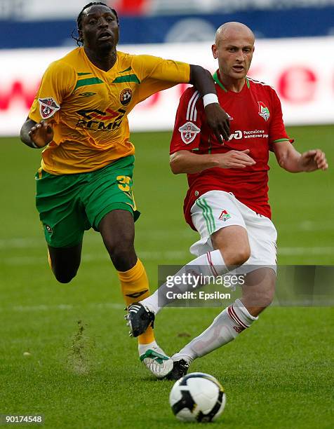 Malkhaz Asatiani of FC Lokomotiv Moscow battles for the ball with Emmanuel Okoduva of FC Kuban Krasnodar during the Russian Football League...