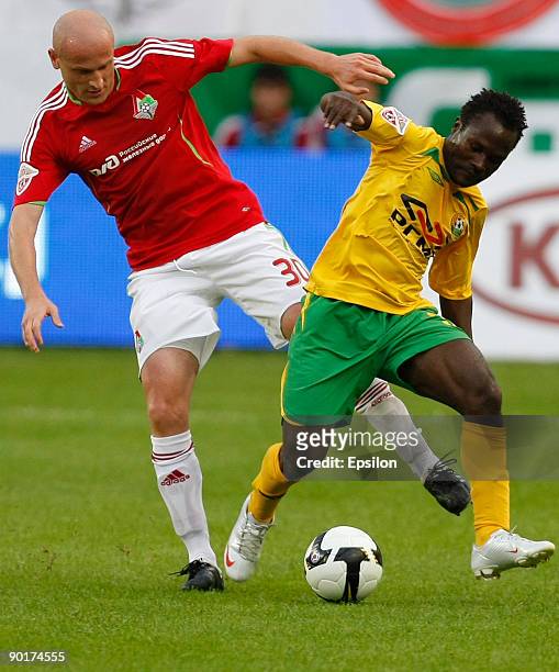 Malkhaz Asatiani of FC Lokomotiv Moscow battles for the ball with Aruna Babangida of FC Kuban Krasnodar during the Russian Football League...