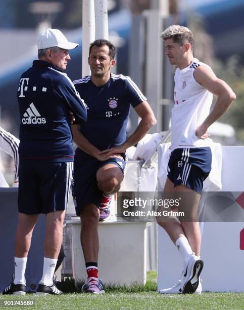 Head coach Jupp Heynckes chats with sport director Hasan Salihamidzic and Robert Lewandowski after a training session on day 5 of the FC Bayern...