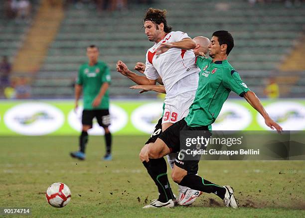 Fernando Sforzini AS Bari battles for the ball with Miguel Angel Britos during the Serie A match between AS Bari and Bologna FC, at Stadio San Nicola...