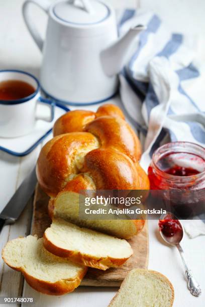 freshly baked sweet braided bread loaf for breakfast. - braided bread stock pictures, royalty-free photos & images