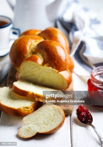 freshly baked sweet braided bread loaf for breakfast. - braided bread stock pictures, royalty-free photos & images