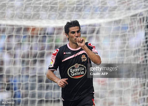 Deportivo's Riki celebrates his goal during their Spanish league football match against Real Madrid at the Santiago Bernabeu Stadium, August 29, 2009...
