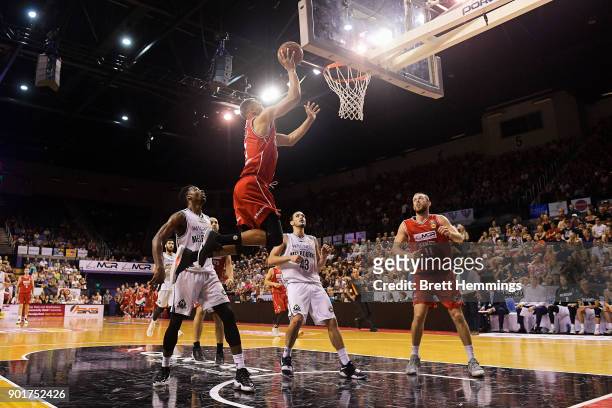 Demitrius Conger of the Hawks lays up a shot under pressure during the round 13 NBL match between the Illawarra Hawks and Melbourne United at...
