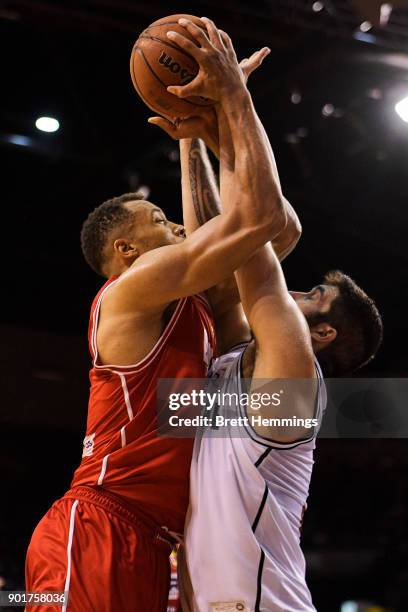 Demitrius Conger of the Hawks lays up a shot under pressure during the round 13 NBL match between the Illawarra Hawks and Melbourne United at...