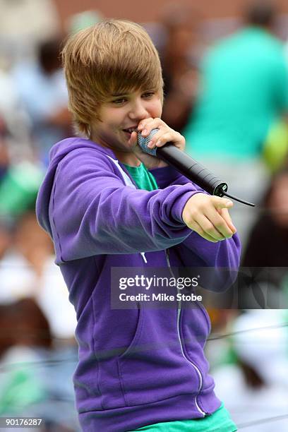 Singer Justin Bieber performs during Arthur Ashe Kid's Day at the 2009 U.S. Open at the Billie Jean King National Tennis Center on August 29, 2009 in...