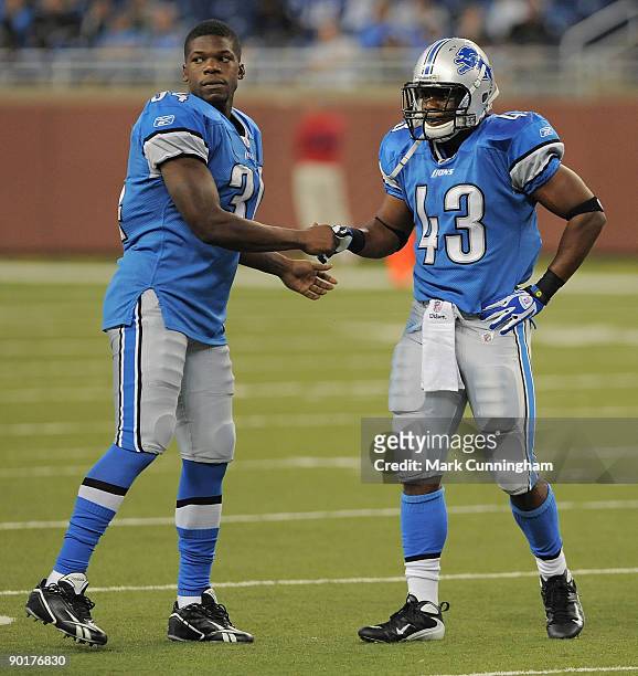 Kevin Smith and Tristan Davis of the Detroit Lions shake hands after a play against the Indianapolis Colts at Ford Field on August 29, 2009 in...
