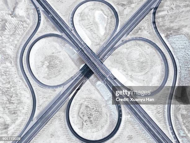 aerial view of a highway intersection in winter - construction circle stockfoto's en -beelden