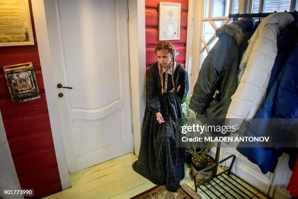 An employee of the marshmallow museum takes a break in Kolomna, some 100 km south of Moscow on January 6, 2018 as Russia celebrates Orthodox...