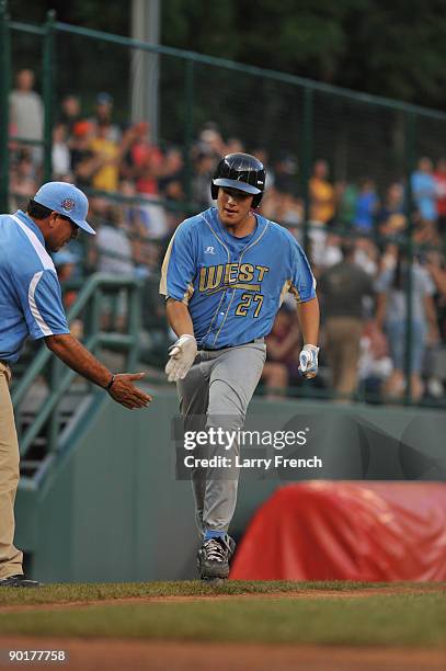 Starting pitcher Luke Ramirez of the West comes home after hitting the game winning home run against the Southwest in the US final at Lamade Stadium...