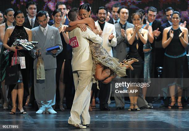 The Italian couple of Sara Masi and Mauro Zompa celebrate after winning the fourth place in the Tango Salon competition during the VII Tango Dance...