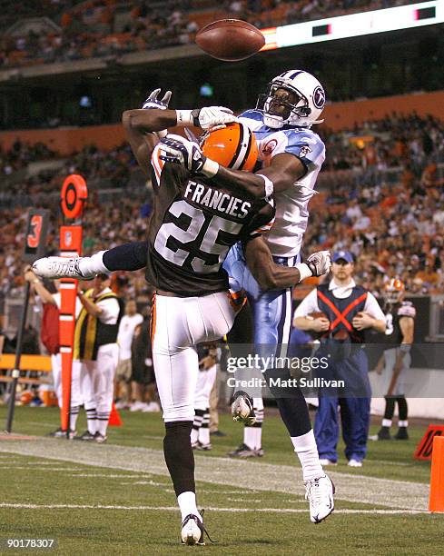 Coye Francies of the Cleveland Browns breaks up a pass to Paul Williams of the Tennessee Titans at Cleveland Browns Stadium on August 29, 2009 in...