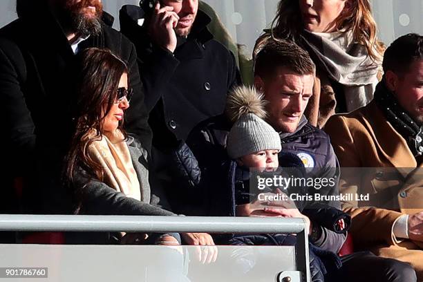 Jamie Vardy of Leicester City looks on from the stand next to his wife Rebekah holding his son Finlay during The Emirates FA Cup Third Round match...