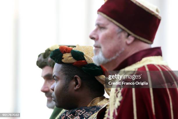 Faithful dressed as three Magi gather in St Peter's Square during the Feast of the Epiphany to attend the Pope Francis' Angelus blessing on January...