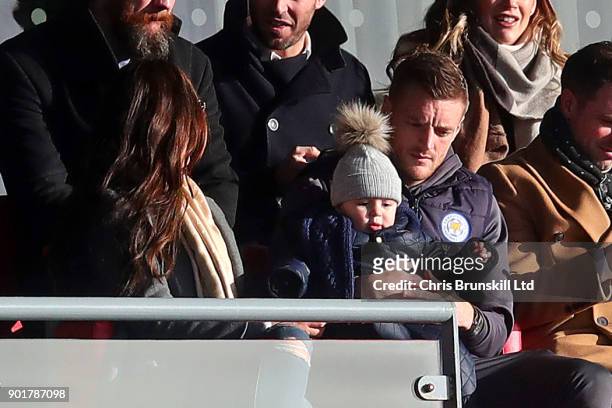 Jamie Vardy of Leicester City looks on from the stand next to his wife Rebekah holding his son Finlay during The Emirates FA Cup Third Round match...